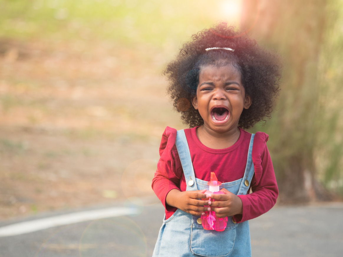 Young child expressing emotions, illustrating the importance of behavioral therapy for kids in developing emotional regulation, coping skills, and positive behavior strategies.